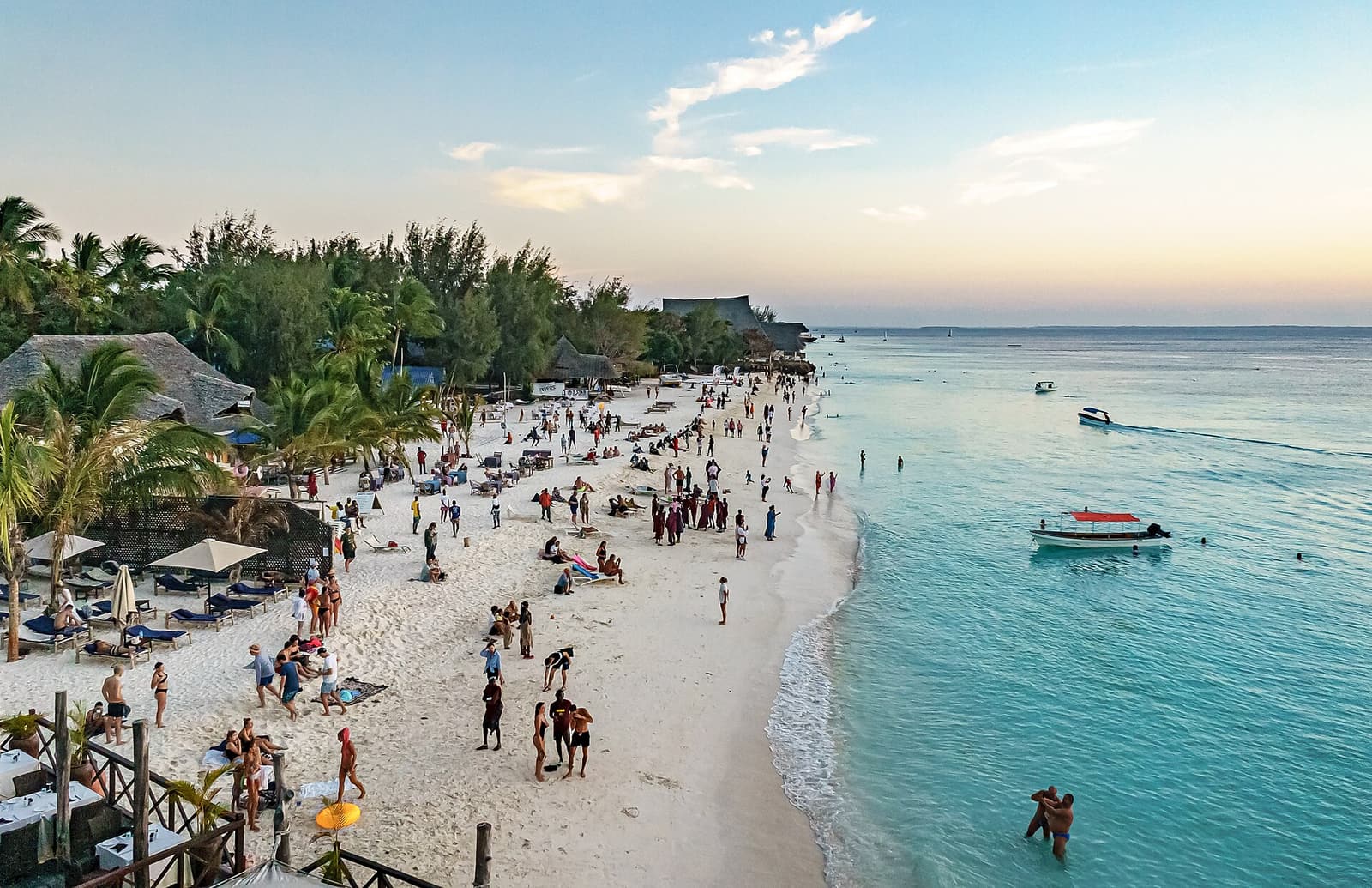 The busy white-sand beach and turquoise water at Nungwi, northern Zanzibar